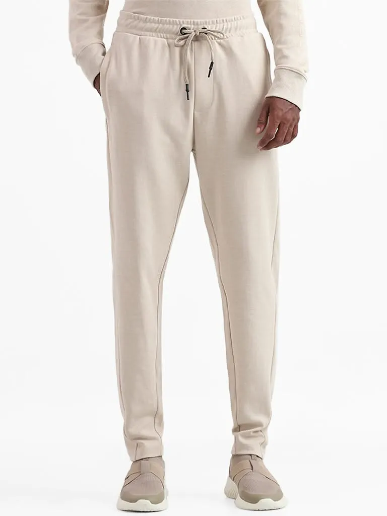 Studiofit Solid Beige Relaxed-Fit Mid-Rise Joggers